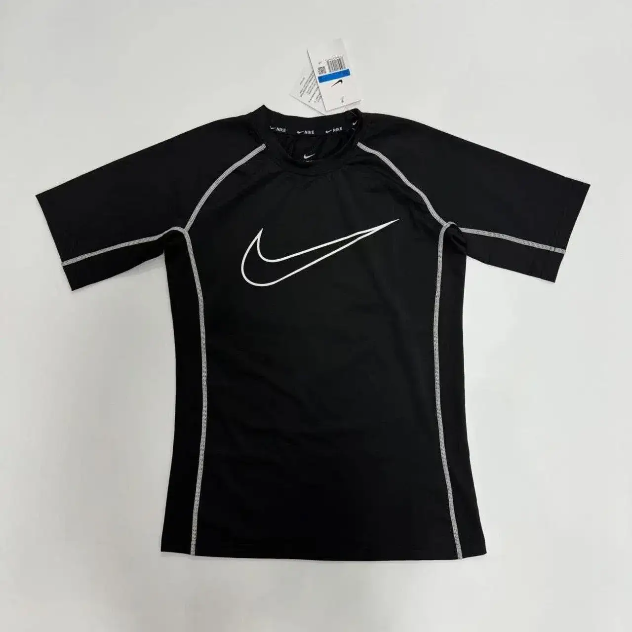 Not a Stone Island T-shirt but rather a women athletic/fitness short-sleeve top from Nike