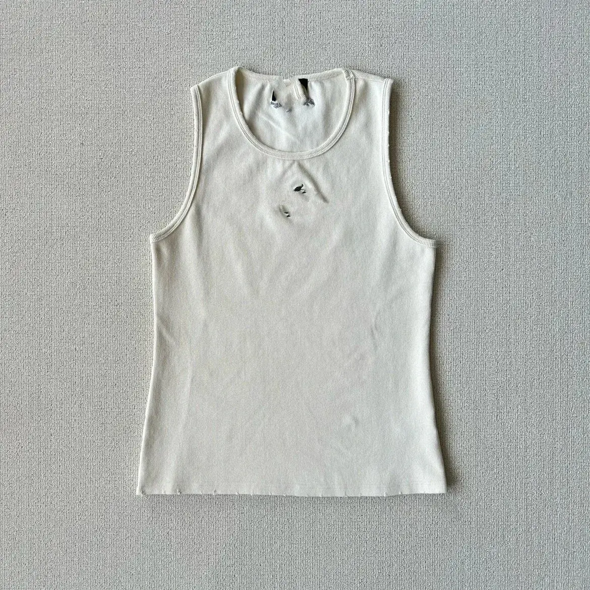 Off-White Ribbed Tank Top with a Distressed Worn-In Look