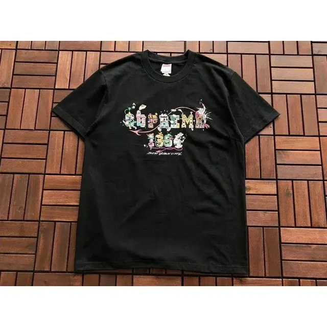 Supreme T-Shirt featuring a cartoon-style graffiti design