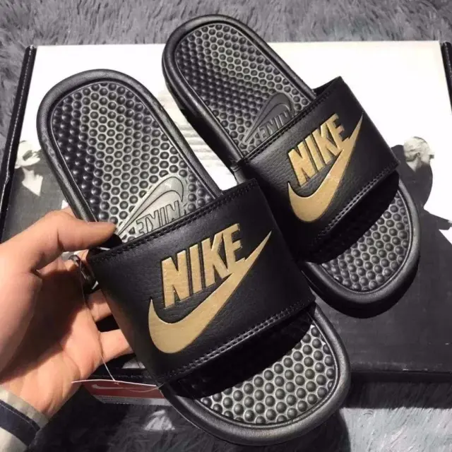 Nike Black and Gold Slide Sandals
